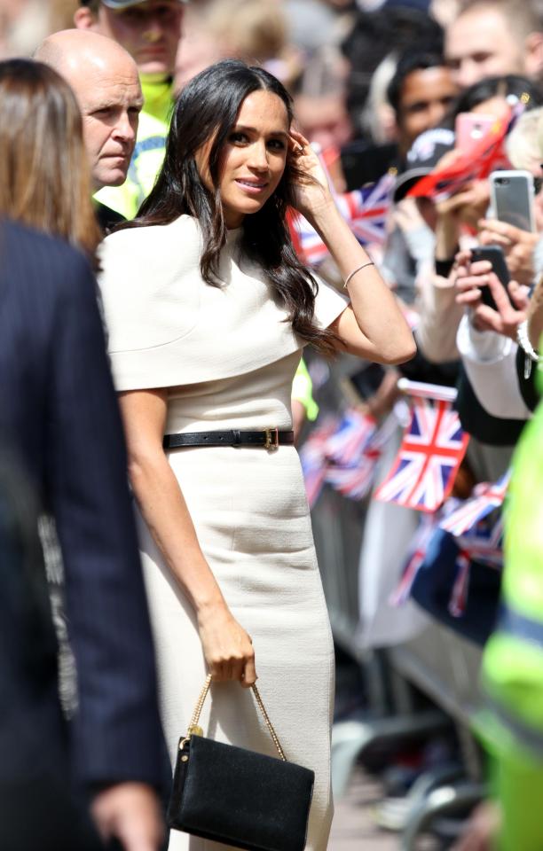  When she visited Cheshire with the Queen, Meghan donned a Givenchy dress