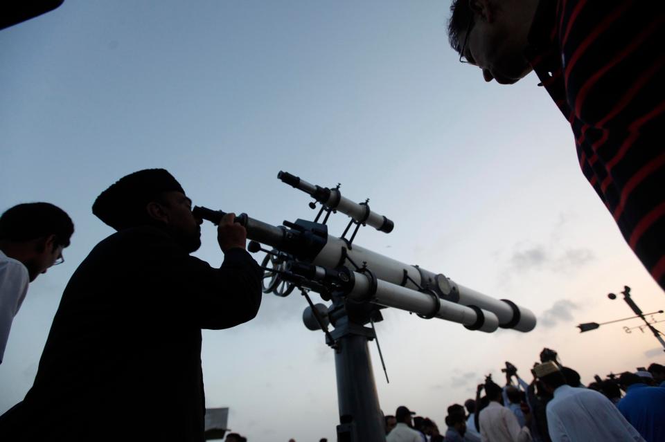  The Shawwal moon-sighting committees use telescopes to spot the arrival of the moon