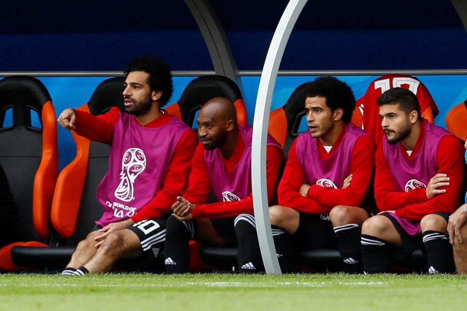  Egypt missed their captain, left, in their opening game against Uruguay