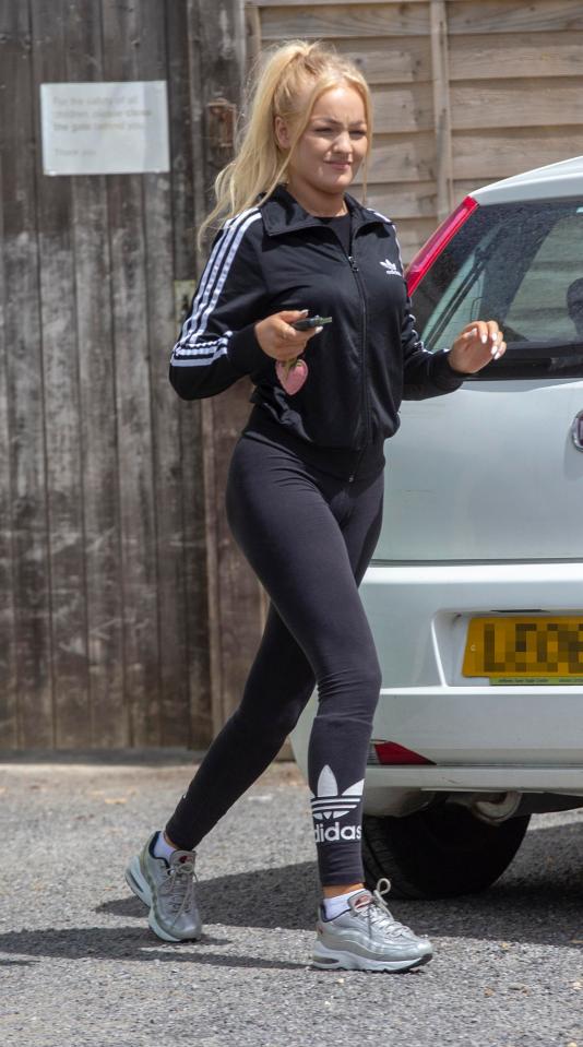  Lauryn donned a black tracksuit as she accompanied her boss on a trip out