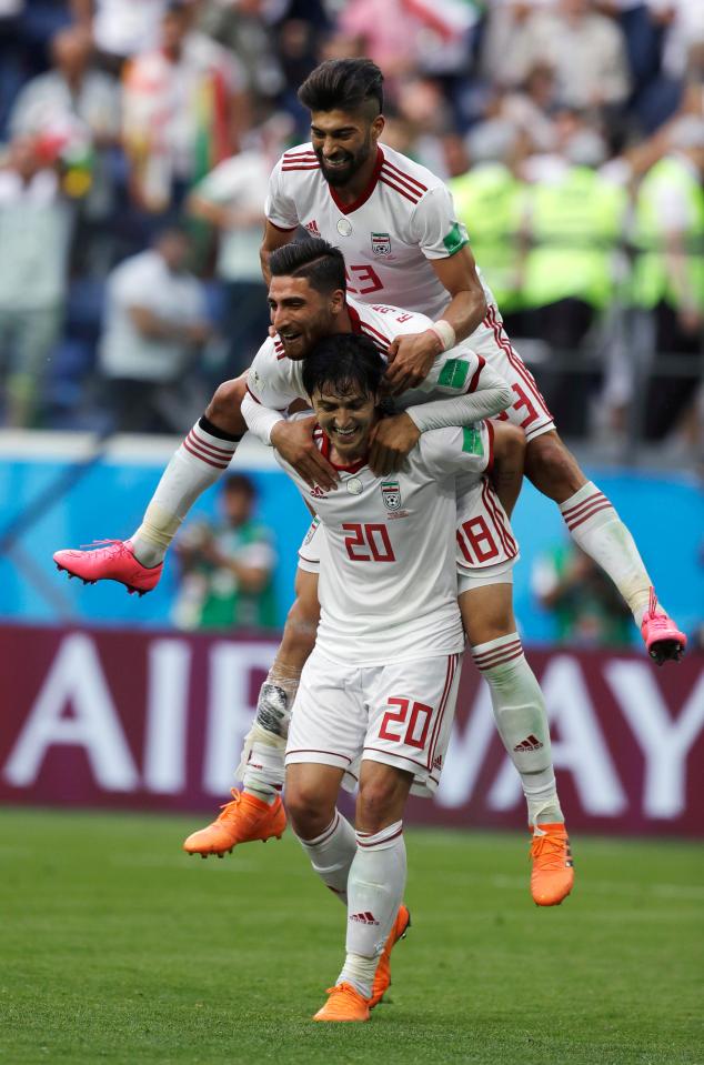  Iran players celebrate after beating Morocco 1-0 with a very late goal