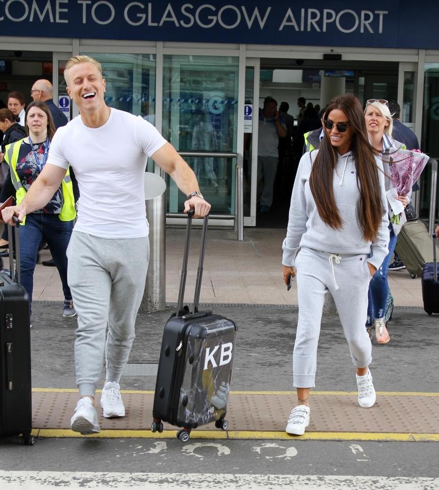  The pair were in high spirits as they left the airport, possibly having not realised the wallet had gone