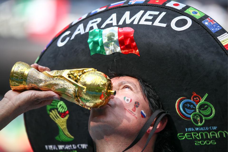  One fan in a sombrero was seen drinking out of a Jules Rimet trophy