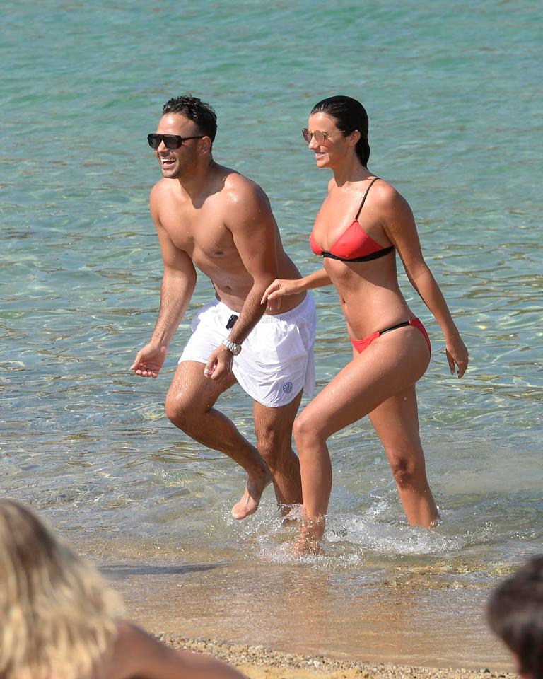  The couple made a very handsome pair as they waded through the sea