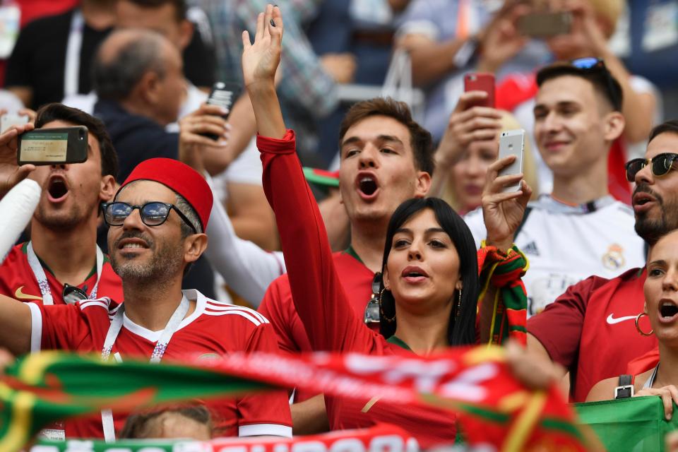  Georgina gives partner Cristiano a wave from the crowd