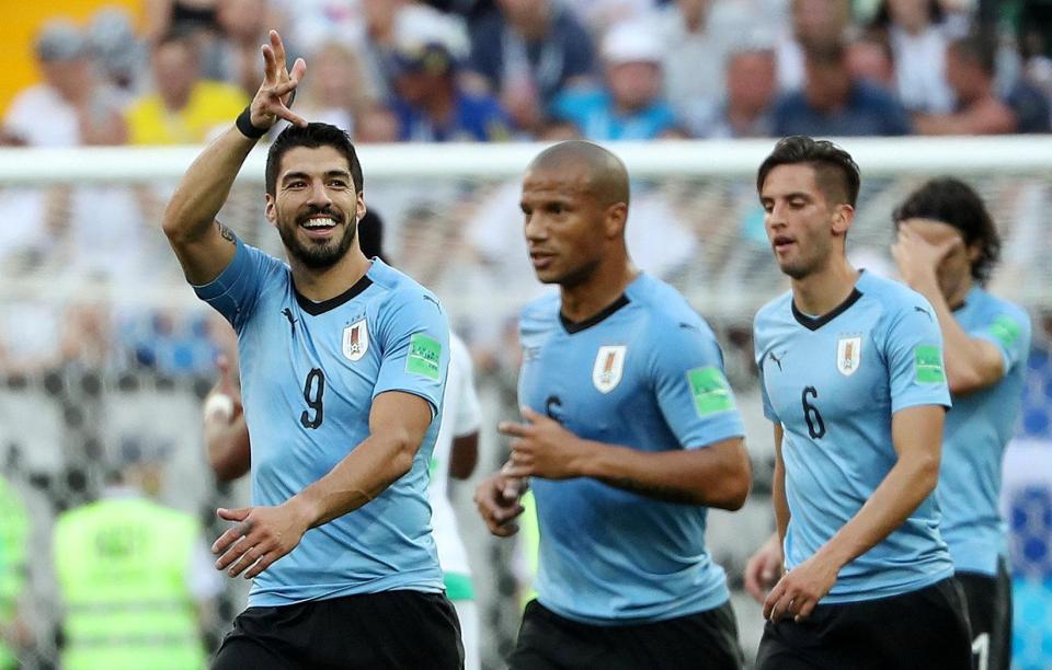  Barcelona ace Luis Suarez celebrates after scoring on Wednesday