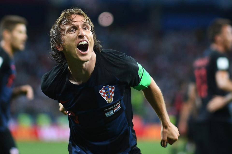  Luka Modric roars after helping Croatia qualify for the last-16