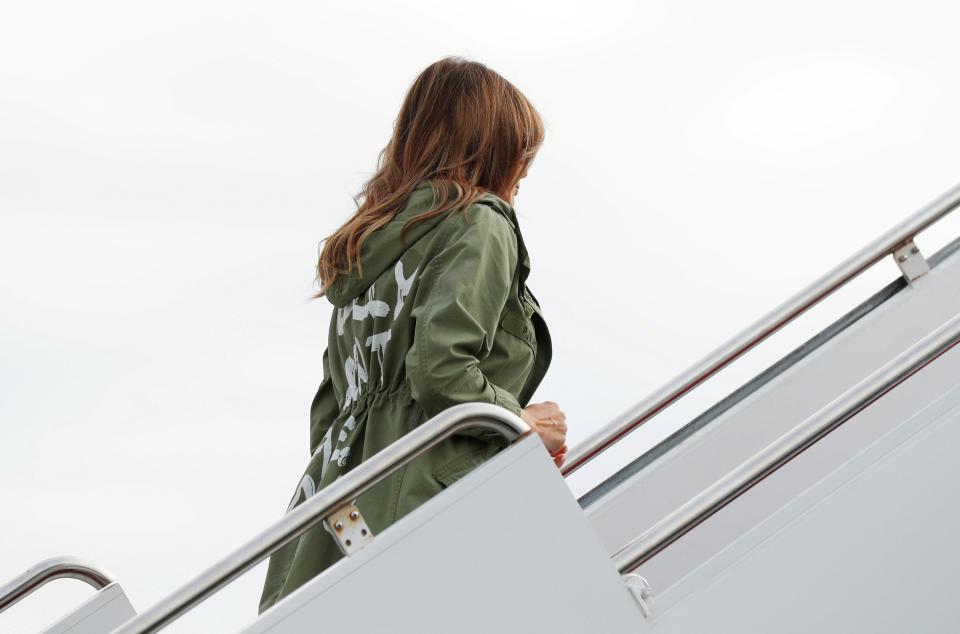  Once she neared the top of the staircase it became clear that her military-style coat had an unusual message on the back