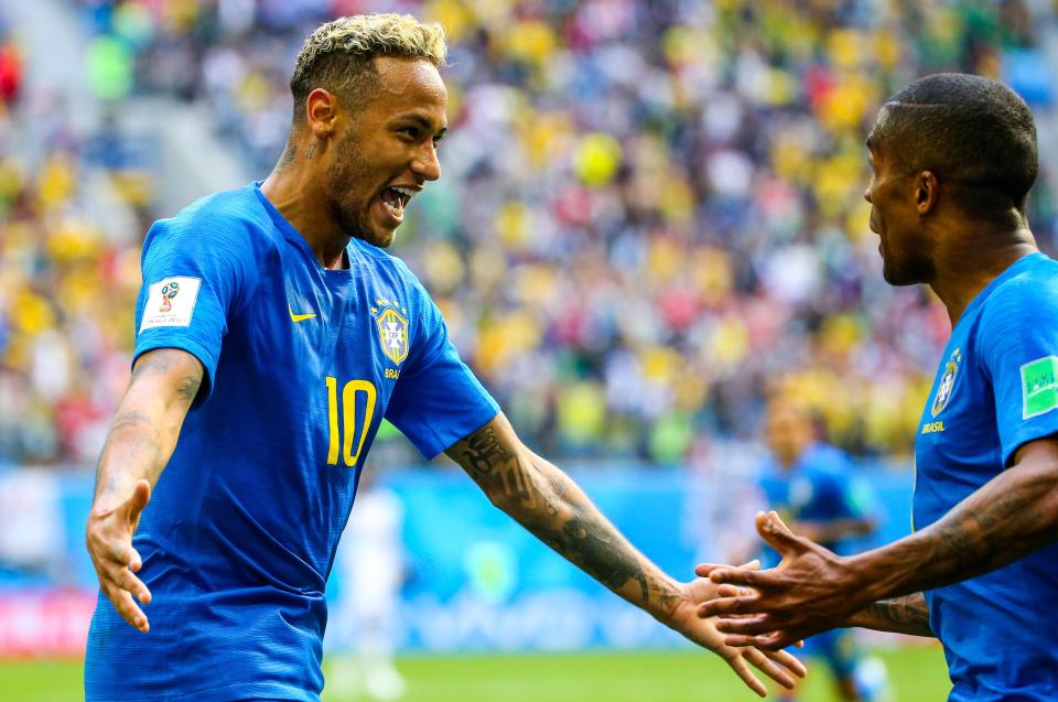  Neymar celebrated with Douglas Costa after scoring to secure the win against Costa Rica