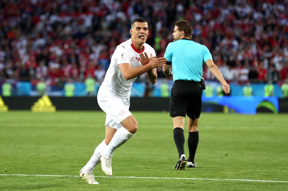  Granit Xhaka sprinted away in celebration while making an Albanian eagle gesture with his hands