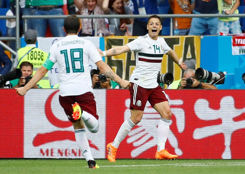 Andres Guardado celebrates with Javier Hernandez as Mexico beat South Korea to top Group G