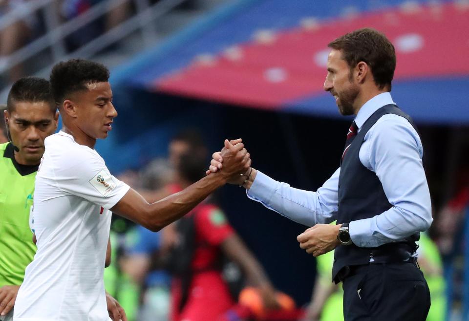  Gareth Southgate shakes Jesse Lingard's hand after the young United star impresses in Russia