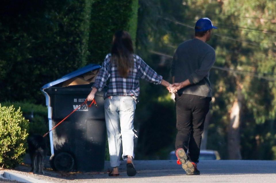  The couple held hands on their day out with pet pooch Zeppelin