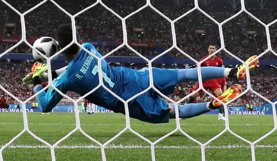  Iran's Alireza Beiranvand brilliant saved his spot-kick