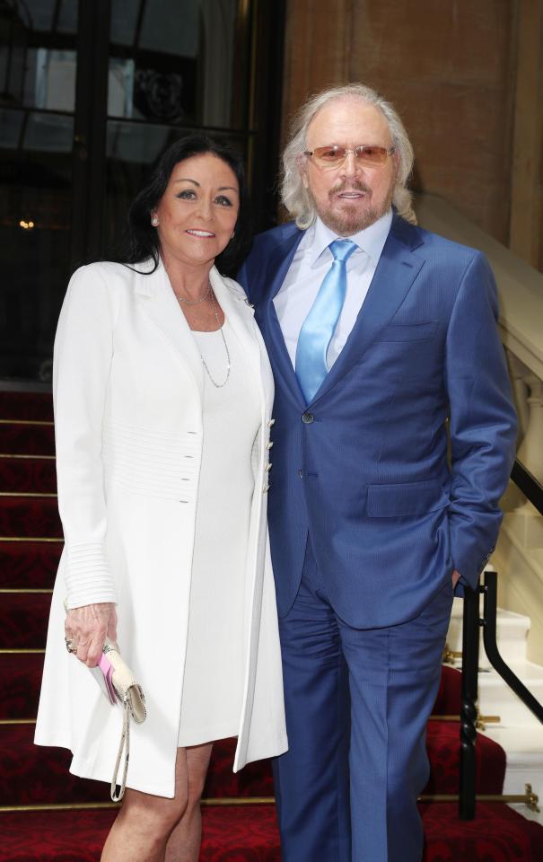  Barry pictured with his wife Linda at Buckingham Palace