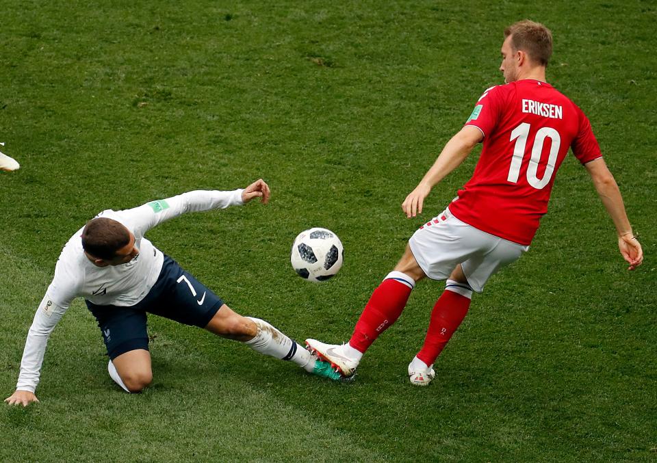 French forward Antoine Griezmann (L) and Denmarks Christian Eriksen battle for the ball