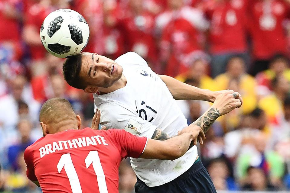 Denmark's forward Martin Braithwaite (L) vies with France's defender Lucas Hernandez