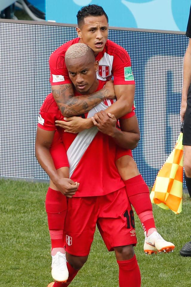 The Peru winger is joined for celebrations as he scored his country's first goal at this summer's World Cup