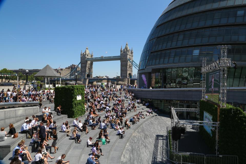  Londoners watch a big screen feed showing the Wimbledon qualifiers - but the weather may not be as nice for the real championship which begins next week