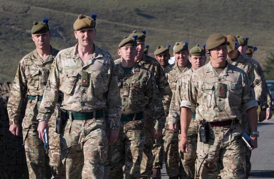 Soldiers from the Royal Regiment of Scotland arrive on Saddleworth Moor near Manchester where they will help fight the blaze