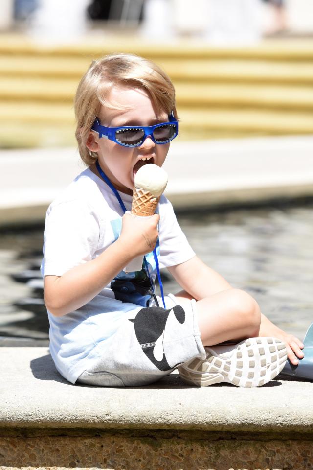 Four-year-old Archie Williams from Warwickshire enjoys an ice cream in the sun