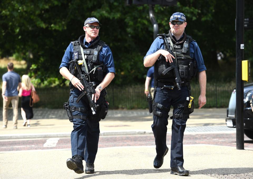 Armed police patrol Hyde Park, keeping an eye on the hundreds of people to descend on the popular park