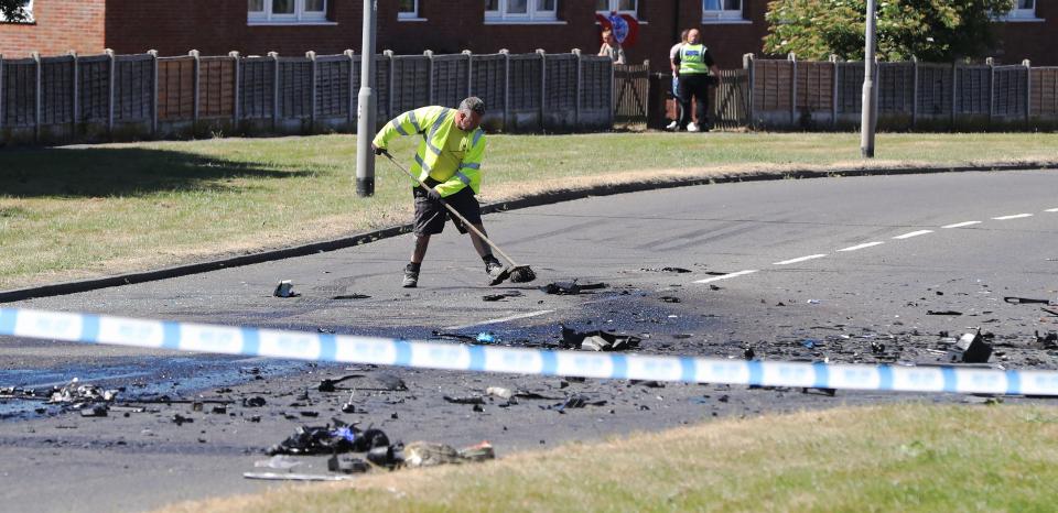  Authorities clear the road of debris after the horror crash unfolded in the early hours of this morning