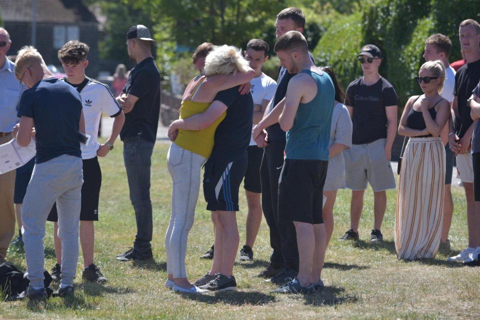  Tearful mourners comforted each other after learning of the tragedy