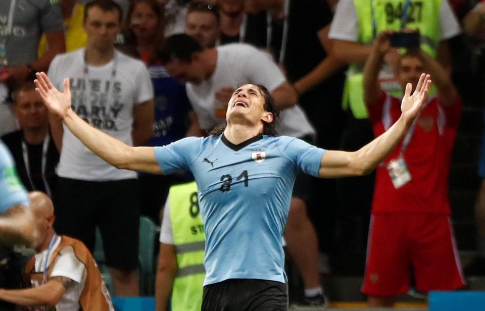  Edinson Cavani celebrates giving his side the all-important lead