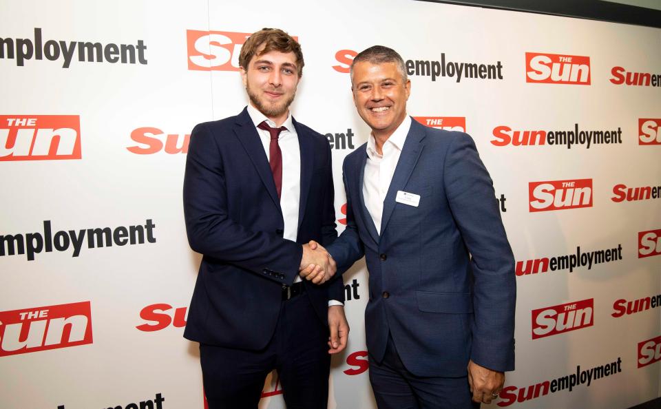  Oliver Clarke shakes hands with Travel Lodge COO Craig Bonnar after landing himself a job with the company