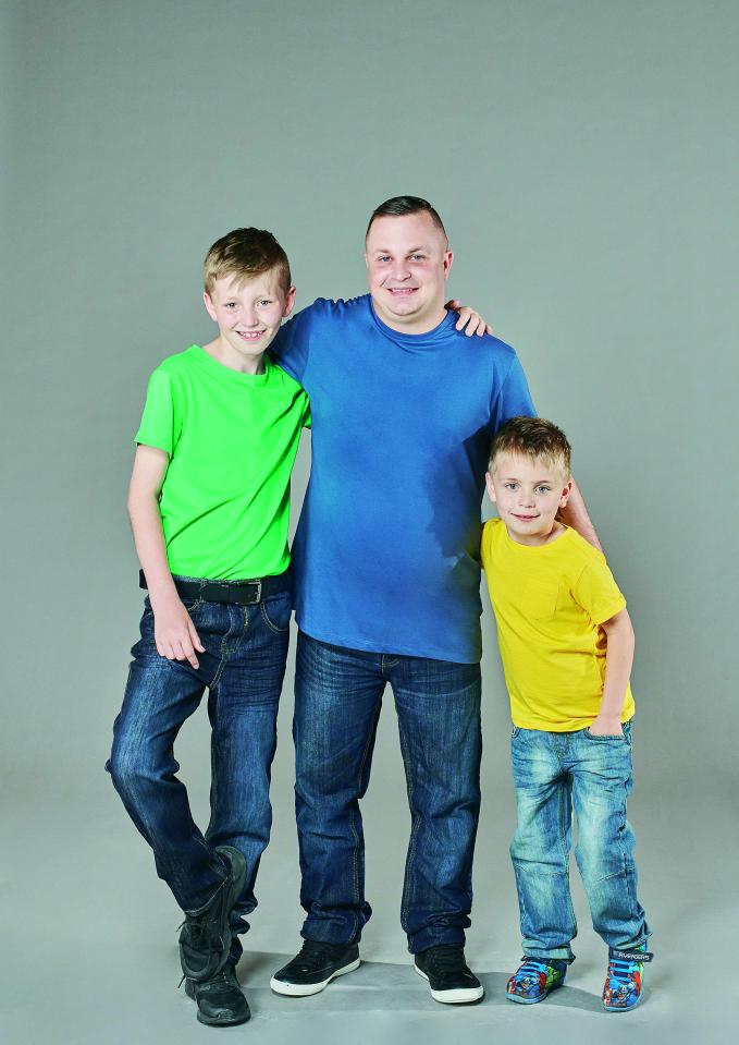  Scott Samuels, 32, with his two sons Kaden, 12, and James, seven