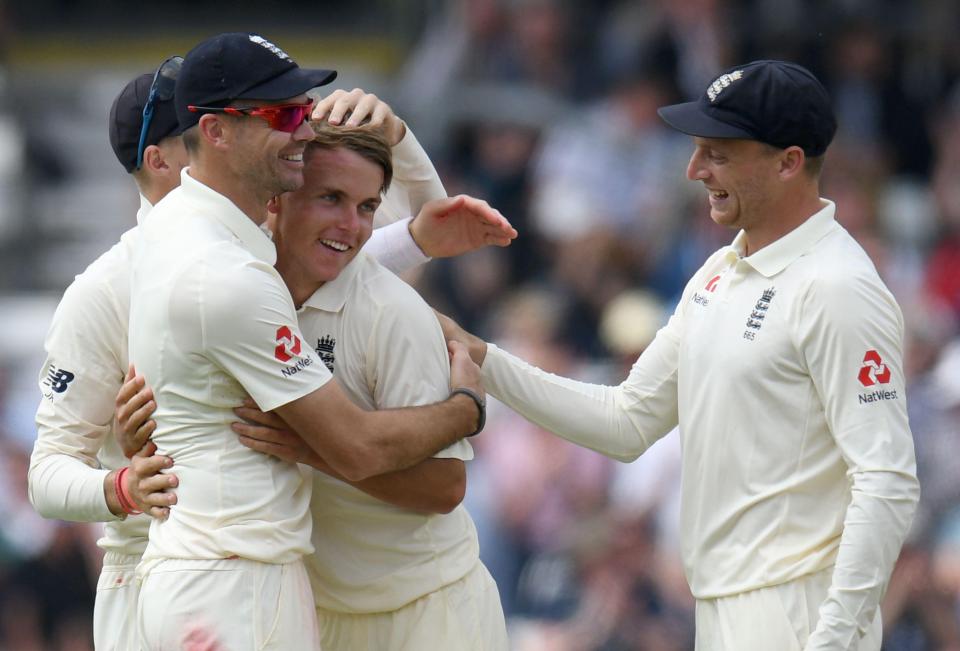  Sam Curran is congratulated by James Anderson and Joe Root after taking the wicket of Shadab Khan