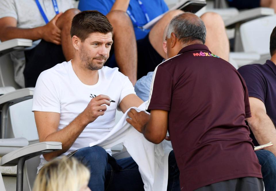  The new Rangers boss signs an autograph for a fan