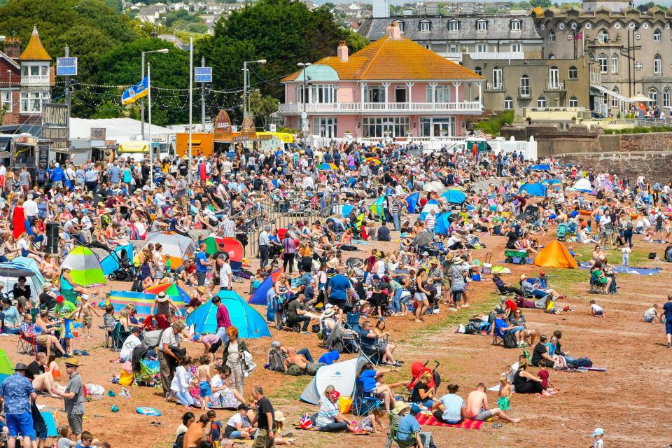  Brits take to the beach in Paignton, Devon as the weather heats up