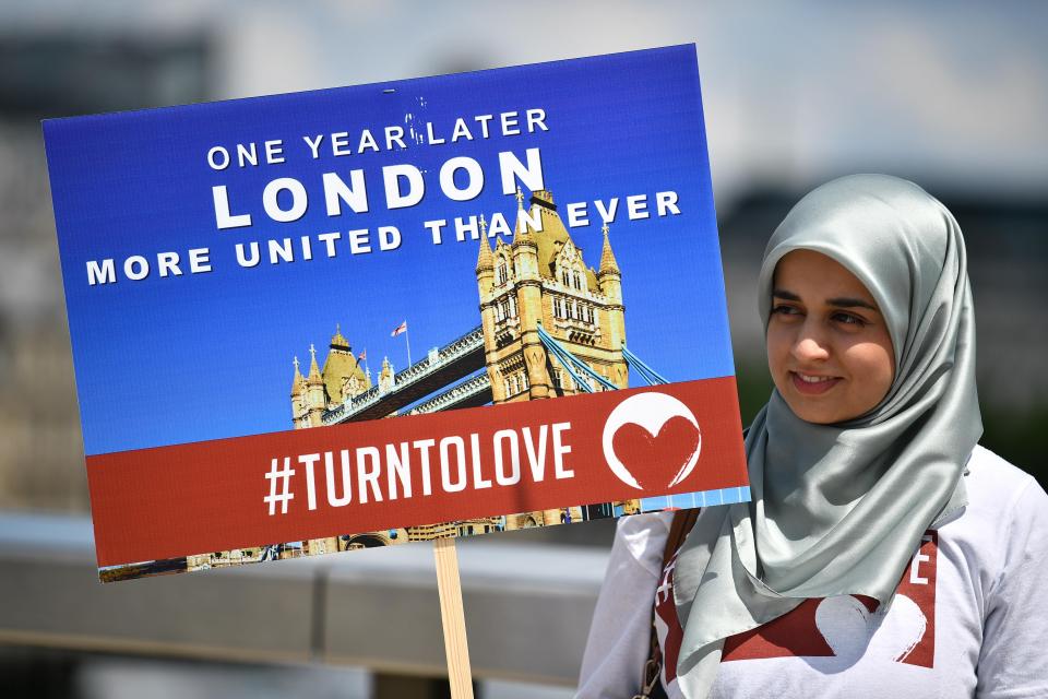  A woman from the Turn To Love campaign shows defiance in the face of last year's horrendous attack