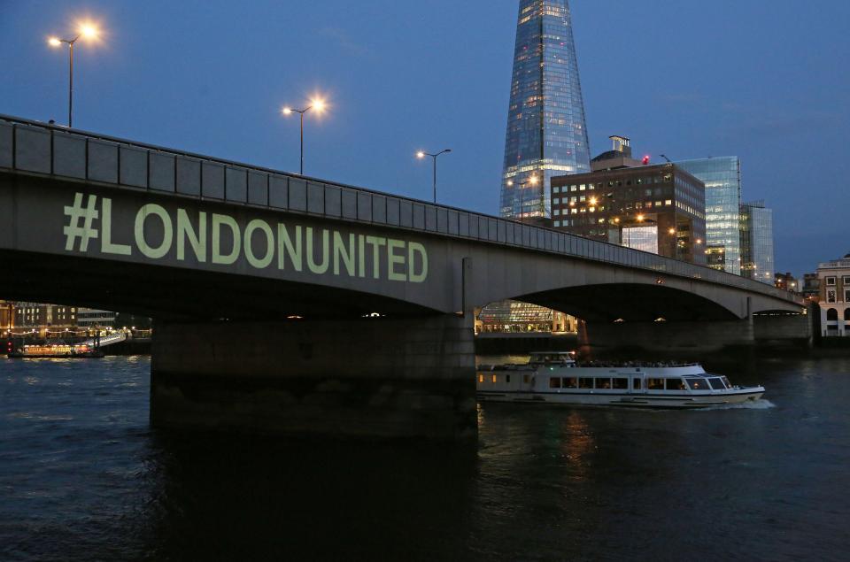  Messages defying terror were shone onto London Bridge to mark the first anniversary of the atrocity