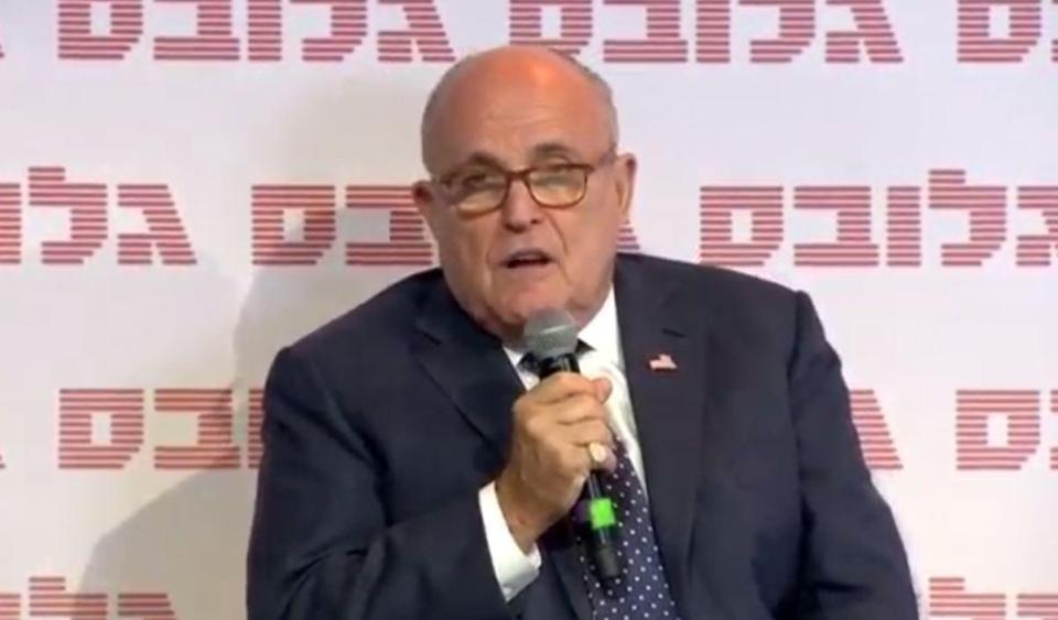  Trump lawyer Rudi Giuliani tells a conference that Kim Jong-un 'begged' for the summit to take place