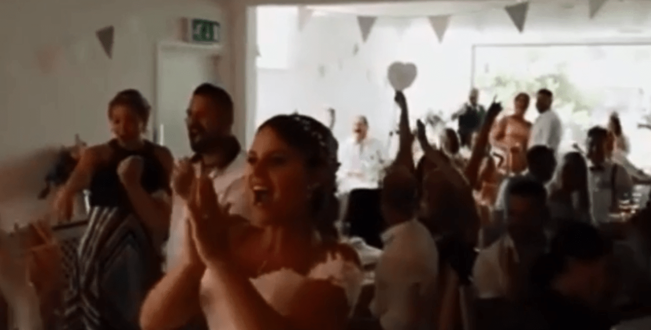 Wedding guests leaped to their feet as they celebrated the goal in the middle of Jenna and Mike Coysh's wedding breakfast