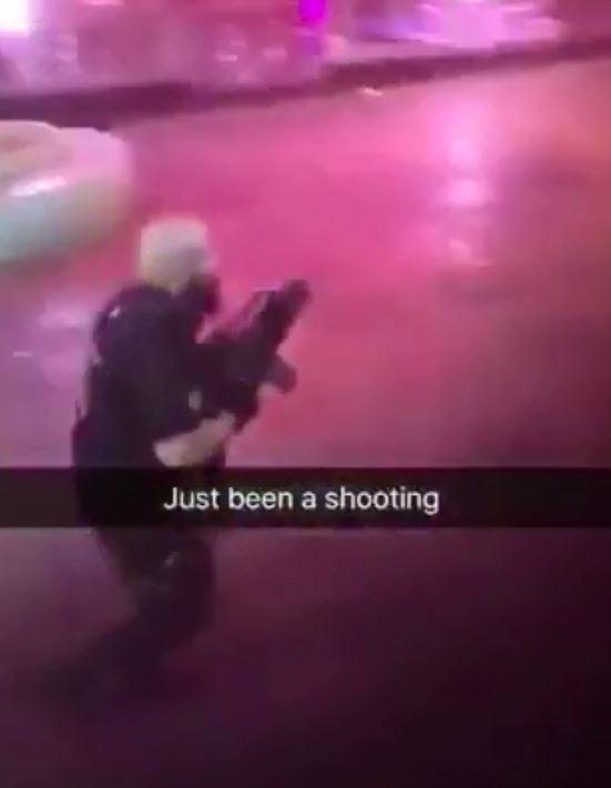  In footage filmed just after the shooting, armed police arrive at the scene