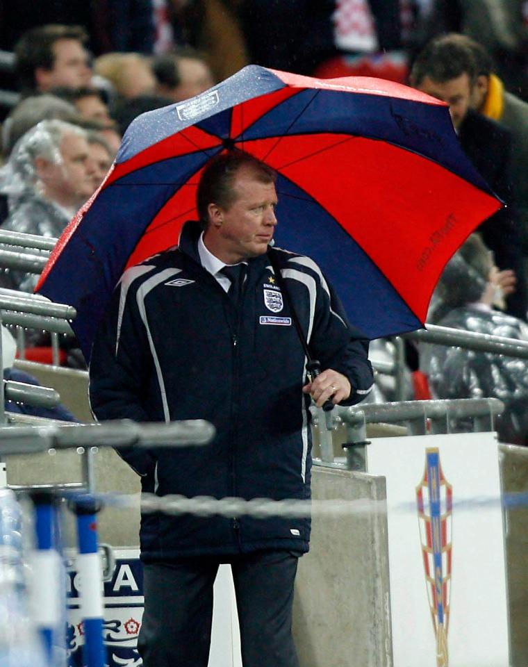  Steve McClaren was sacked after he watched his side crash to defeat under the cover of an umbrella