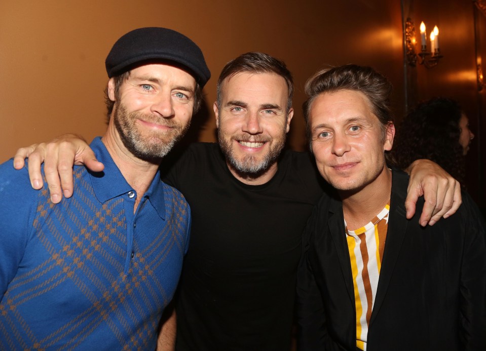 TV bosses hope Howard, here with Take That band members Gary Barlow, centre, and Mark Owen, will attract a new audience for the motoring show