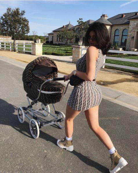 Kylie Jenner steps out with Stormi pushing a Fendi pram that matched her outfit