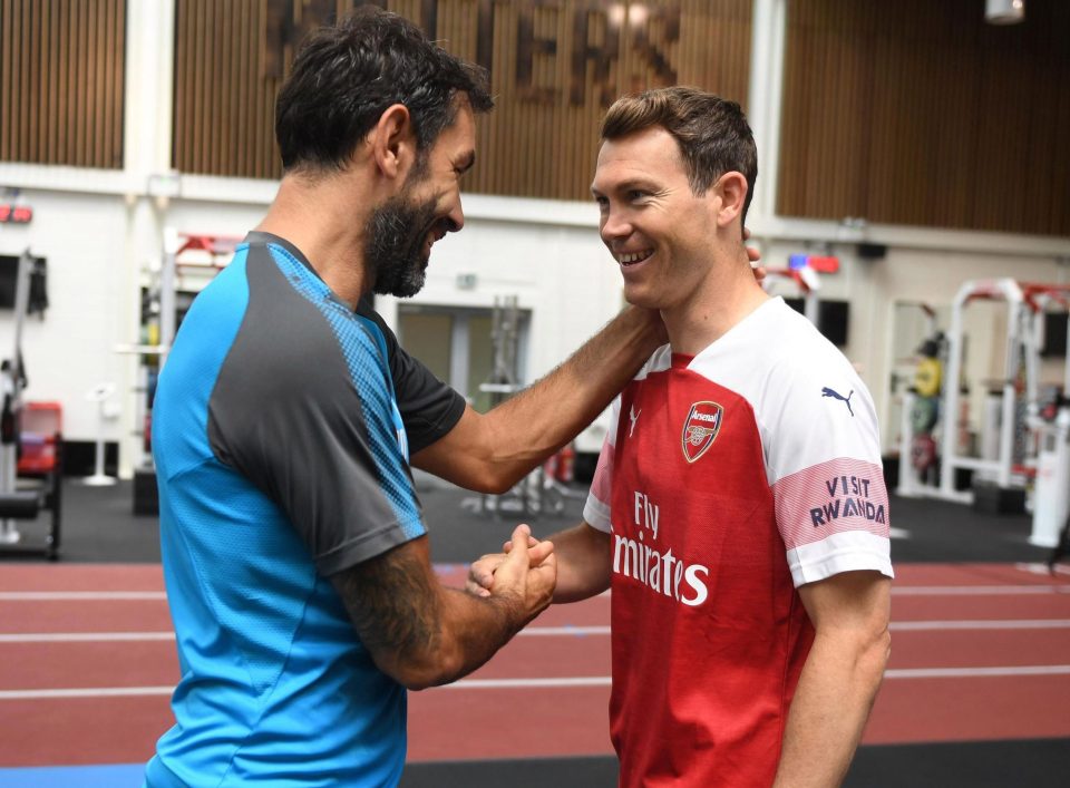  Arsenal legend Robert Pires and the defender at Arsenal's training camp