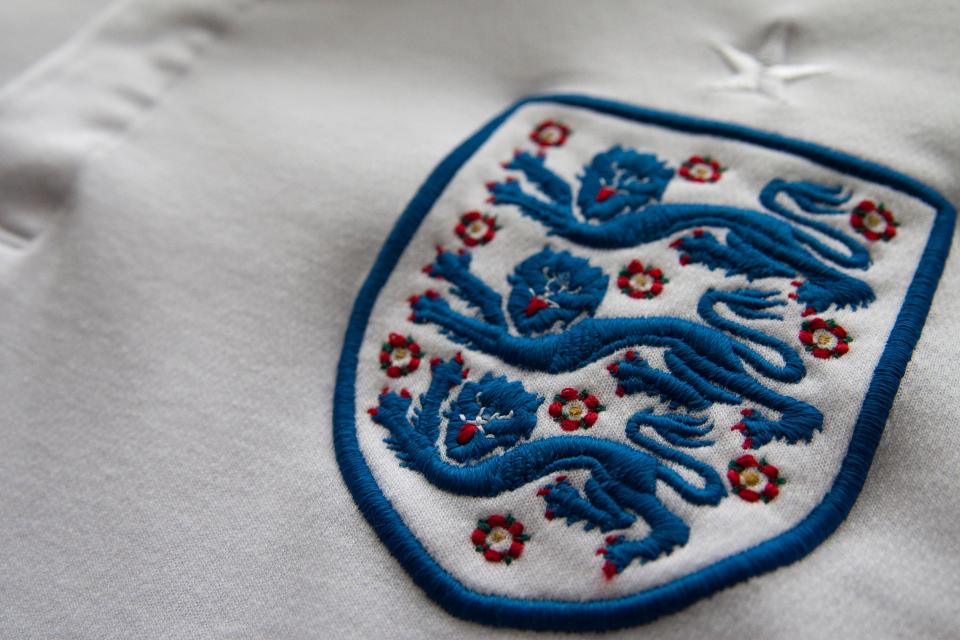  England's iconic Three Lions badge and ten red roses