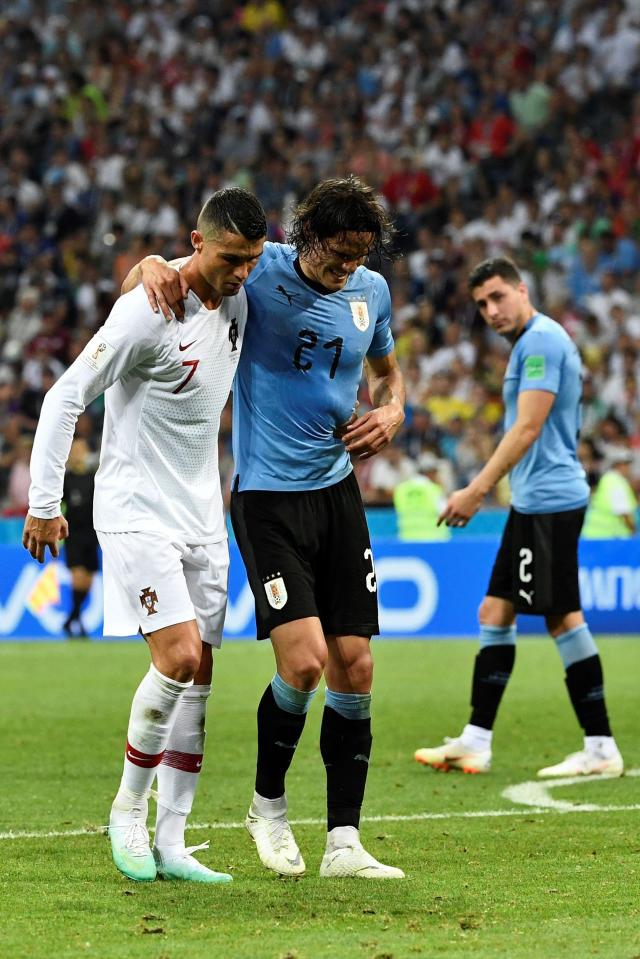  Cristiano Ronaldo helped Cavani off the pitch in Sochi