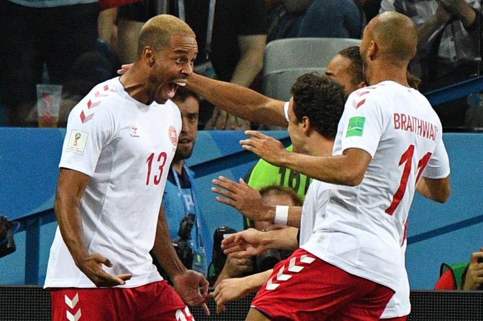  Denmark celebrate after going ahead just one minute into the match