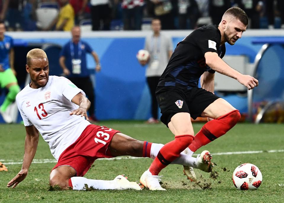  Mathias Jorgensen slides through the back of Ante Rebic in the penalty area