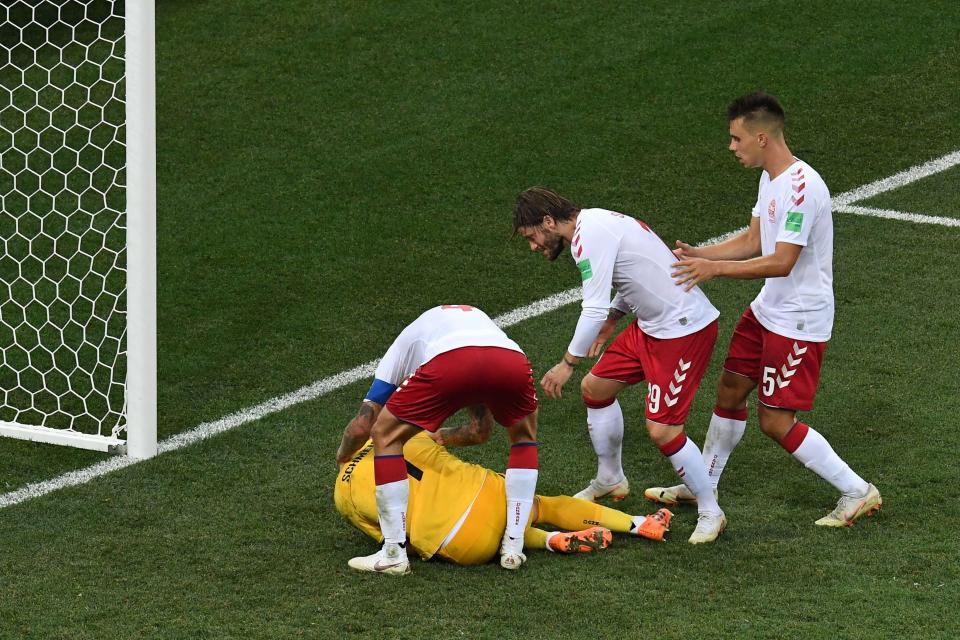  Denmark stars rush to celebrate with Kasper Schmeichel after he saves Luka Modric's penalty