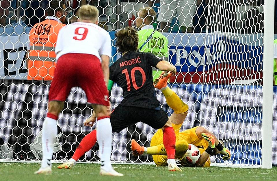  Kasper Schmeichel dives the right way and saves Luka Modric's late penalty