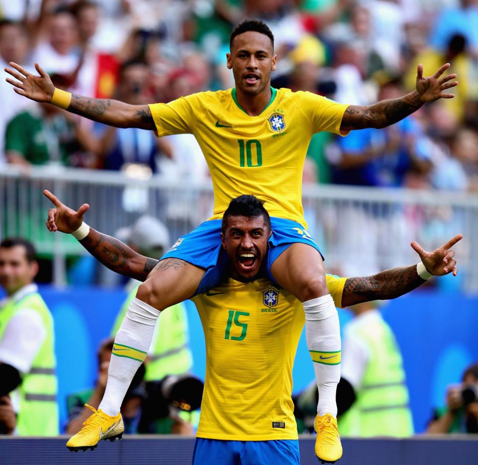  Neymar celebrates with Paulinho after the second half strike